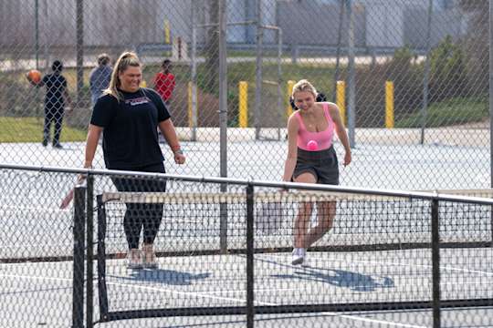 2 people playing Pickleball